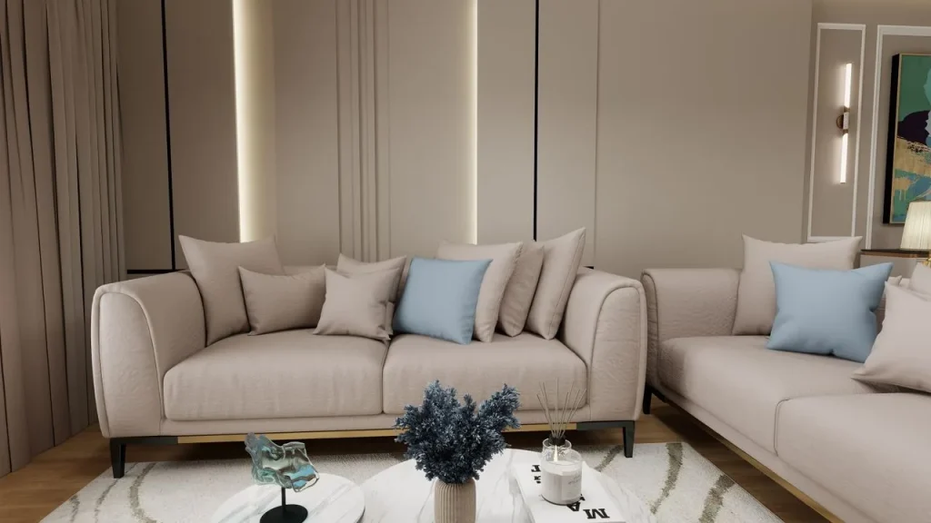 Sala bege com sofá, almofadas e objetos decorativos de linhas contemporâneas.